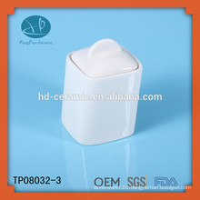 white ceramic honey jar with lid
